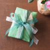 Gift wrap with green organza ribbons and Coolyroe label