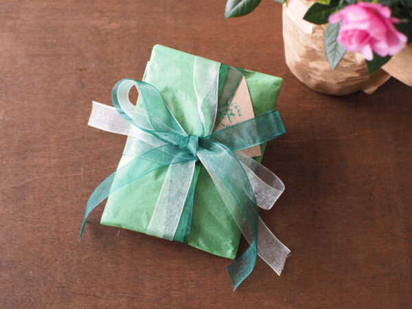 Gift wrap with green organza ribbons and Coolyroe label